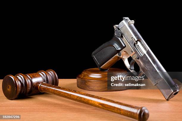 fire arm rights shown by a gavel and firearm